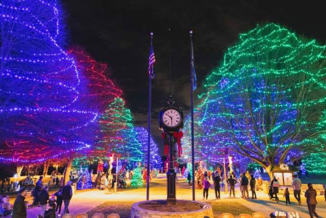 Holiday lights in a town center with a giant clock in the center in Delaware County