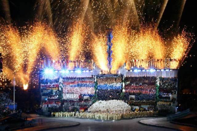 In this February 8, 2002, file photo, fireworks burst over the athlete tribune at the Rice-Eccles Olympic Stadium in Salt Lake City during the Opening Ceremonies for the 2002 Olympic Winter Games.