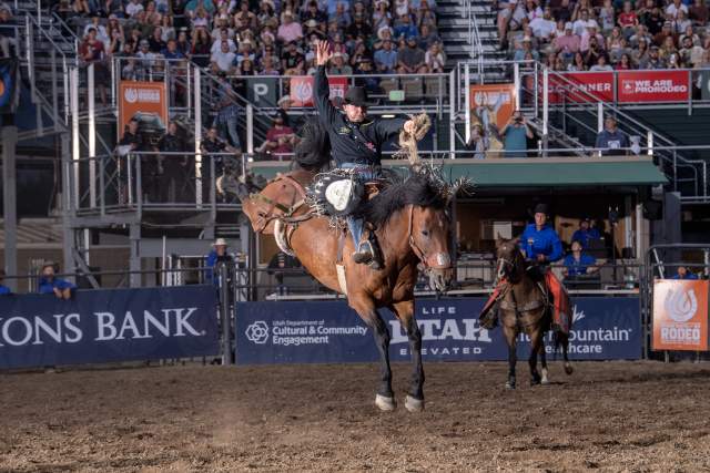 This photo depicts Brody Wells riding Black Tie (Horse) at a Utah Days of '47 Rodeo in Salt Lake.