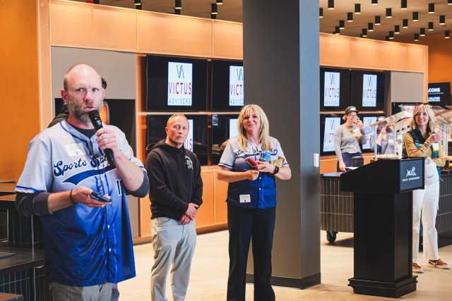 Leadership of Sports Salt Lake standing and speaking at the Sports Social 2025