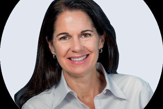 Smiling woman in white button down shirt cropped by a circle