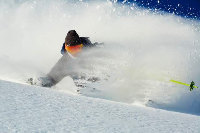 Skier in powder at Brighton Ski Resort