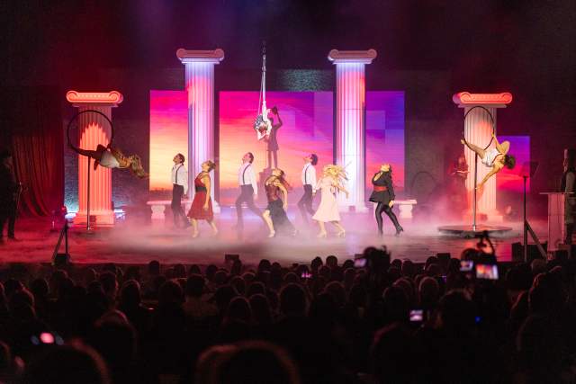 Artists performing on stage at the 2025 Salt Awards. Singing and dancing, colorful lights and a bit of stage smoke