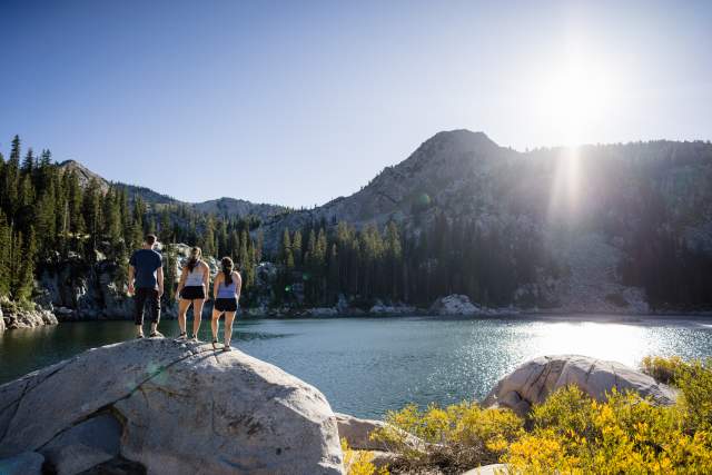 Friends hiking to a lake in Big Cottonwood Canyon