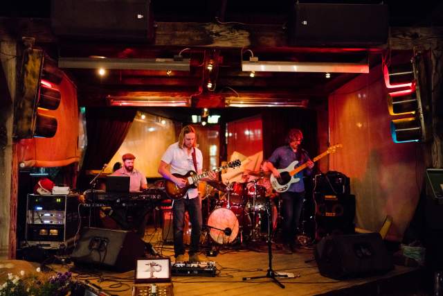 Band On Small Stage Playing Live Music At The Garage on Beck