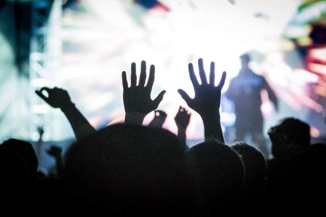 Salt Lake City Concert-goer in the crowd raising their hands