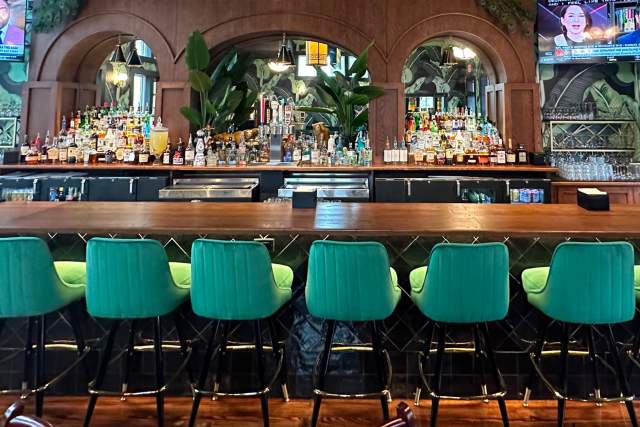 Bar top with green chairs
