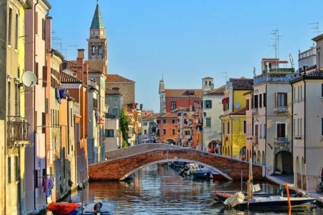 Pastel buildings and a canal in Chioggia's Old Town