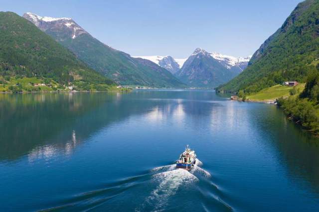 A boat gliding through Sognefjord