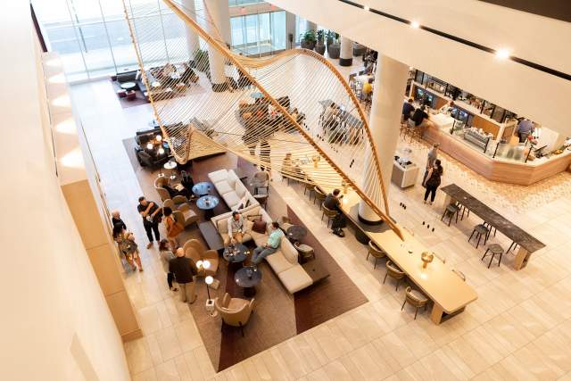A hotel lobby with people gathering