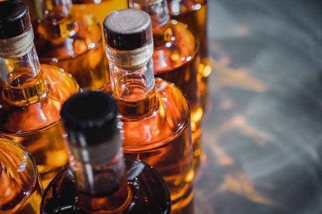 Bottles of liquor from a distillery getting prepared to ship.