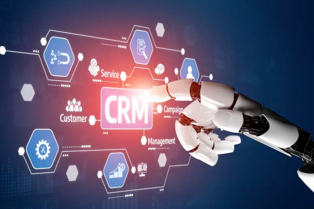 A robotic hand interacts with a digital CRM interface, symbolizing AI-driven customer data and analytics.
