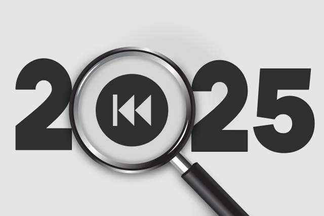 The year 2025 written out with a magnifying glass and rewind symbol over where the zero would be.