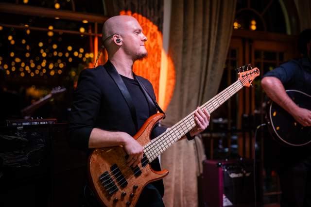 Live electric guitar performance on stage at a Swansea Bay music event