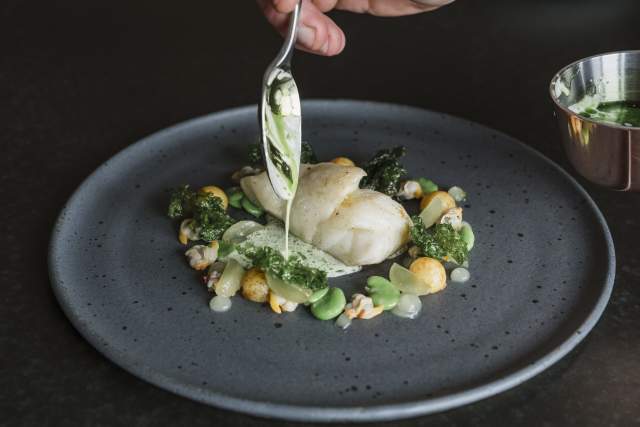 A plate of food prepared by the Beach House