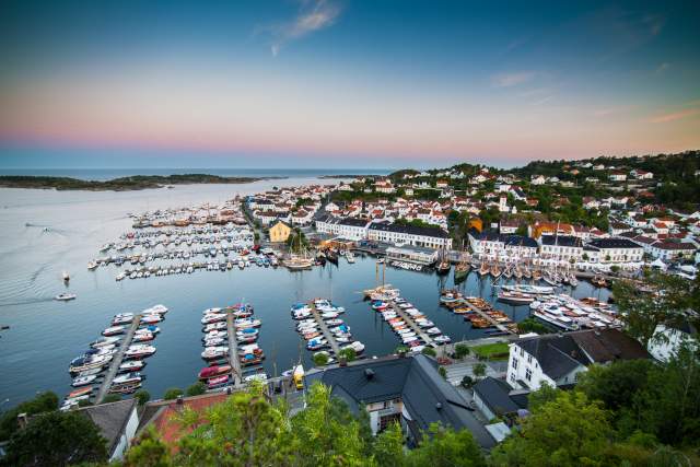 Overview of Risør harbour at dawn