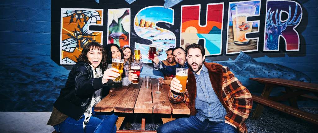Friends drinking at Fisher Brewing