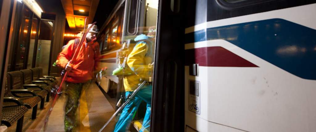 Skiers boarding a Utah Transit Authority TRAX car