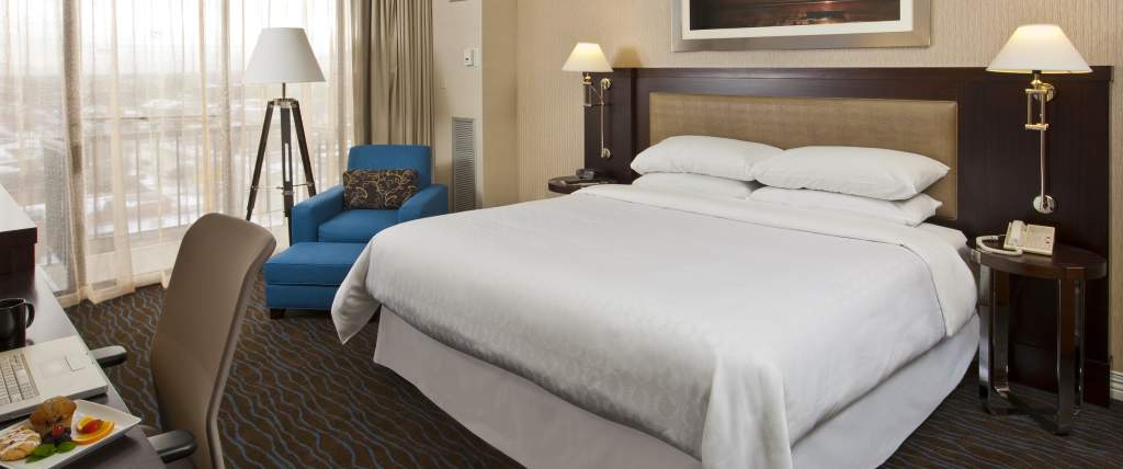 Hotel room with queen sized bed and city views in Sheraton Hotel Downtown Salt Lake City