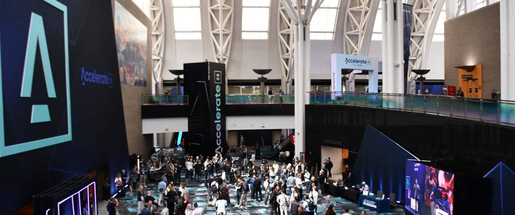 Photo of a large open area at the Salt Palace Convention Center from the top of the grand staircase looking toward the exhibit halls