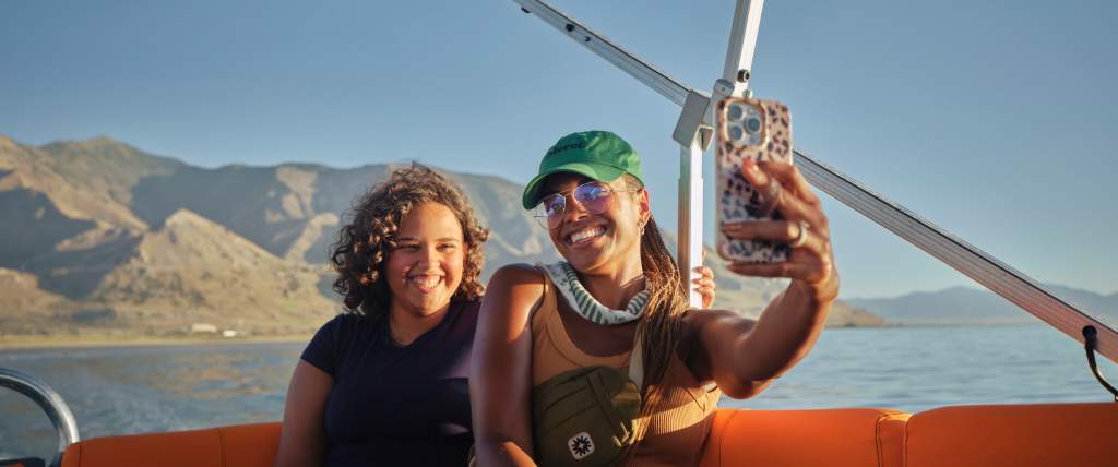 Mother and daughter taking a selfie on a boat tour of the Great Salt Lake.