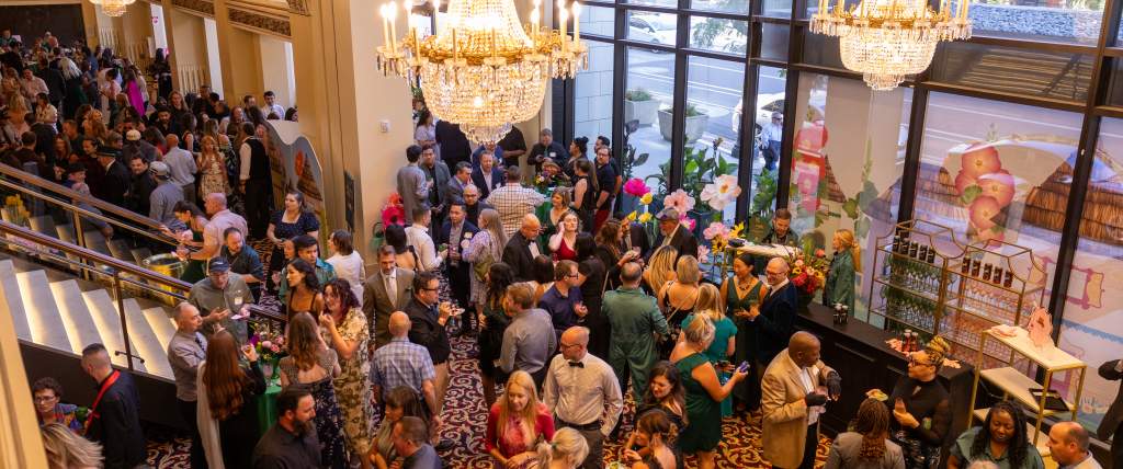 Aerial view of crowd of people networking and talking in the lobby of the Capitol Theater