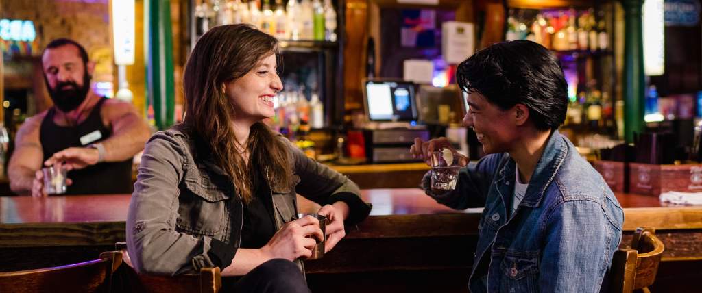 Couple drinking at bar in Salt Lake