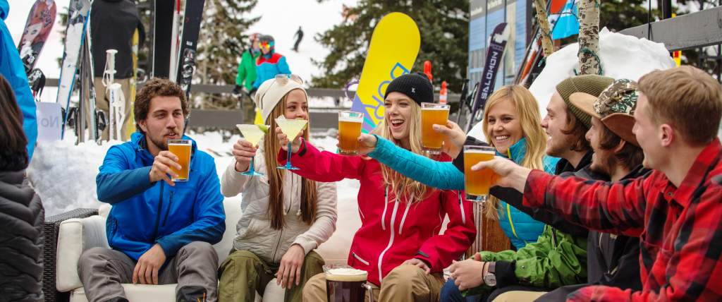 Friends Drinking at Snowbird Tram Deck after Skiing