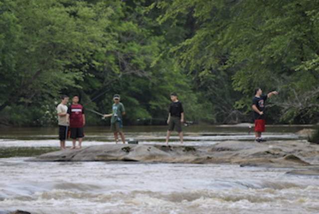 group of people fishing at the Tyger River Foundation’s first annual Fish the Tyger event