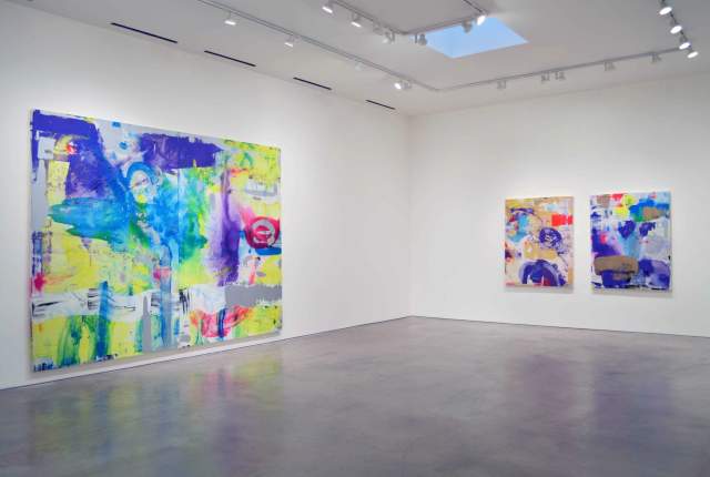 Interior of Barbara Davis Gallery displaying large abstract paintings in a bright white exhibition space.