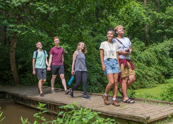 Friends & Couples Walking Across Small Wooden Bridge at Nixon Park