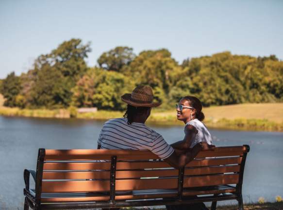Couple sitting by the lake