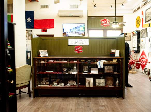Interior of the Red River Railroad museum in the Katy Depot. Shelving unit of local history donated from family members whose parents and grandparents worked for the MKT.