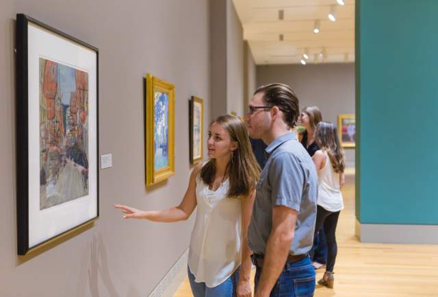 Couple enjoying artwork in a Columbia SC gallery