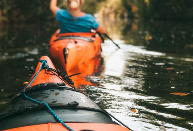 Orange kayaks in the water
