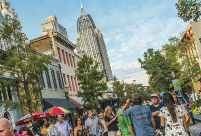 group of people walking in the street downtown