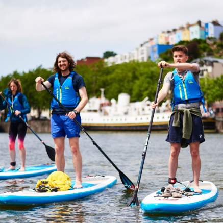 Group on paddelboards in Bristol harbour - credit SUP Bristol