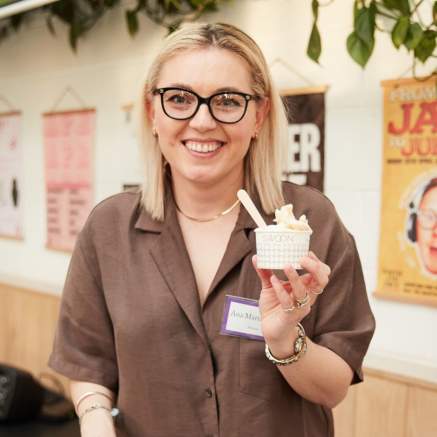 Person holding up cup of gelato - credit Charlotte Tolhurst