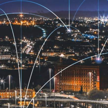 An ariel view of Bristol with lines of light connecting the buildings