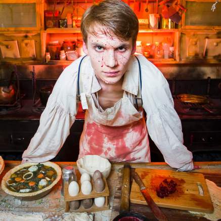 An actor dressed as a butcher covered in fake blood inside Brunel's SS Great Britain, Bristol - credit Adam Gasson