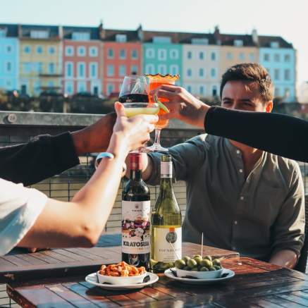 Friends drinking cocktails and wine on the terrace at Harbour House in the Redcliffe area of Bristol - credit Harbour House