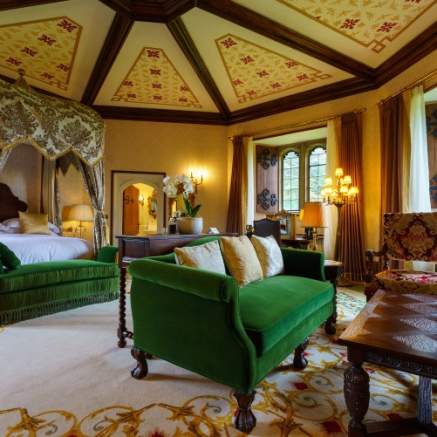 Grand hotel room with four poster bed