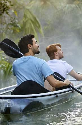 Gay couple kayaking through Kings Landing at Wekiva River