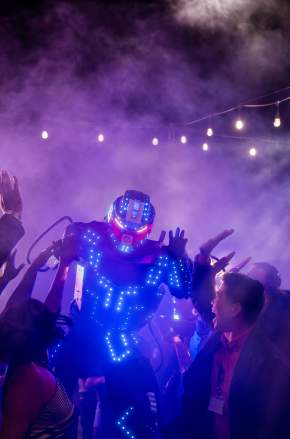 Stiltwalkers perform at a party for meeting planners at the Lake Nona Wave Hotel
