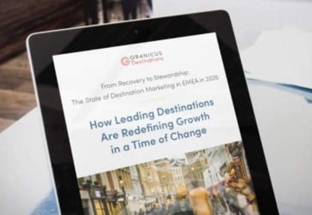 A tablet displaying a Granicus resource guide titled ‘How Leading Destinations Are Redefining Growth in a Time of Change.