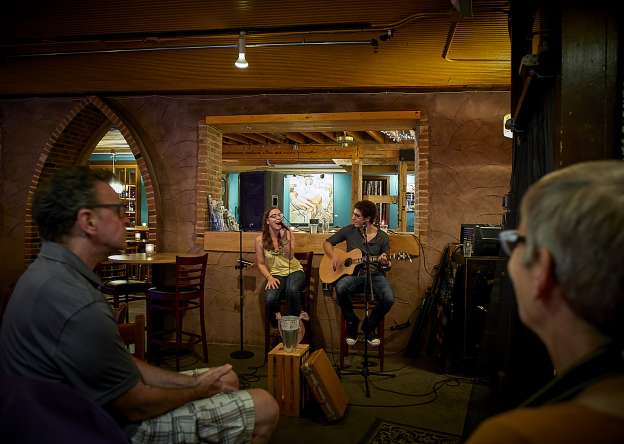 Couple performing live music in bar