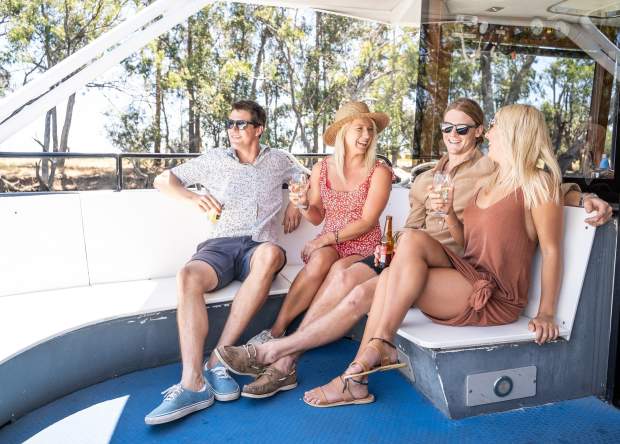 Group of friends aboard a Swan Valley Tours cruise on the Swan River