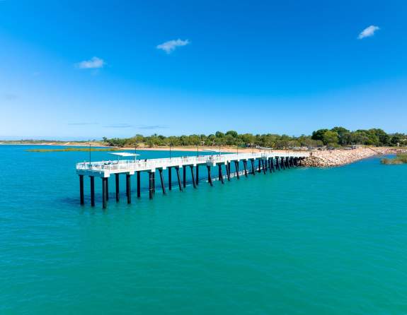 Taken from the water, the images shows the jetty at Town Beach Broome stretching back to shore