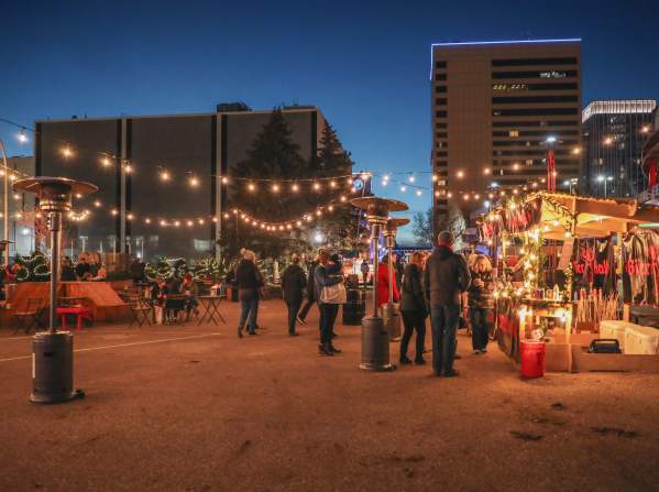 event with people outside during the winter with twinkly lights overhead
