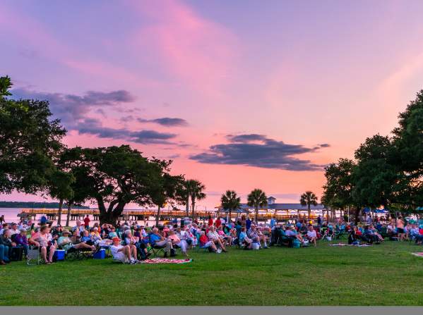 Crowd Sitting On The Grass In The Golden Isles, GA